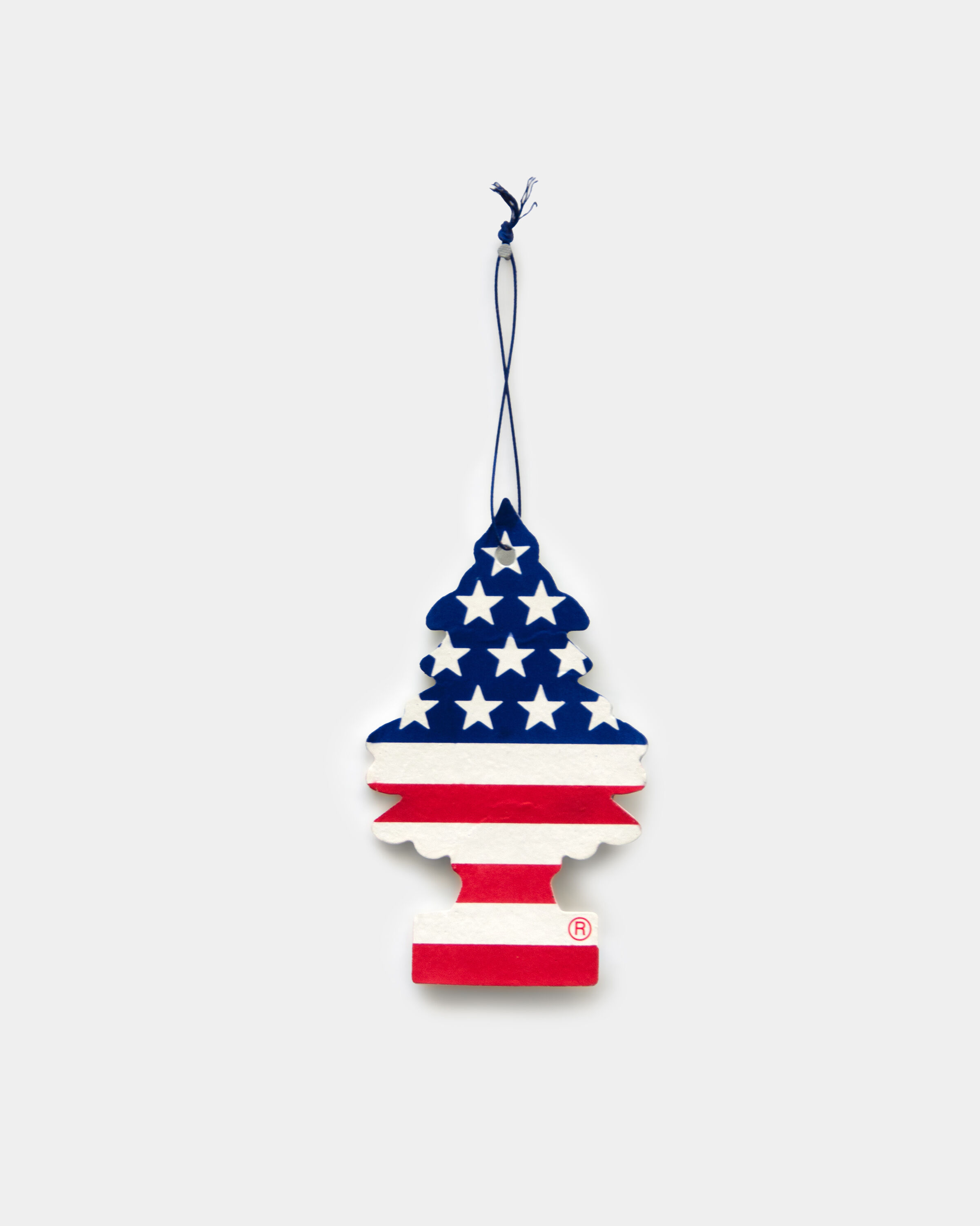 A cast bronze air freshener painted with the american flag by Mitchell Charbonneau